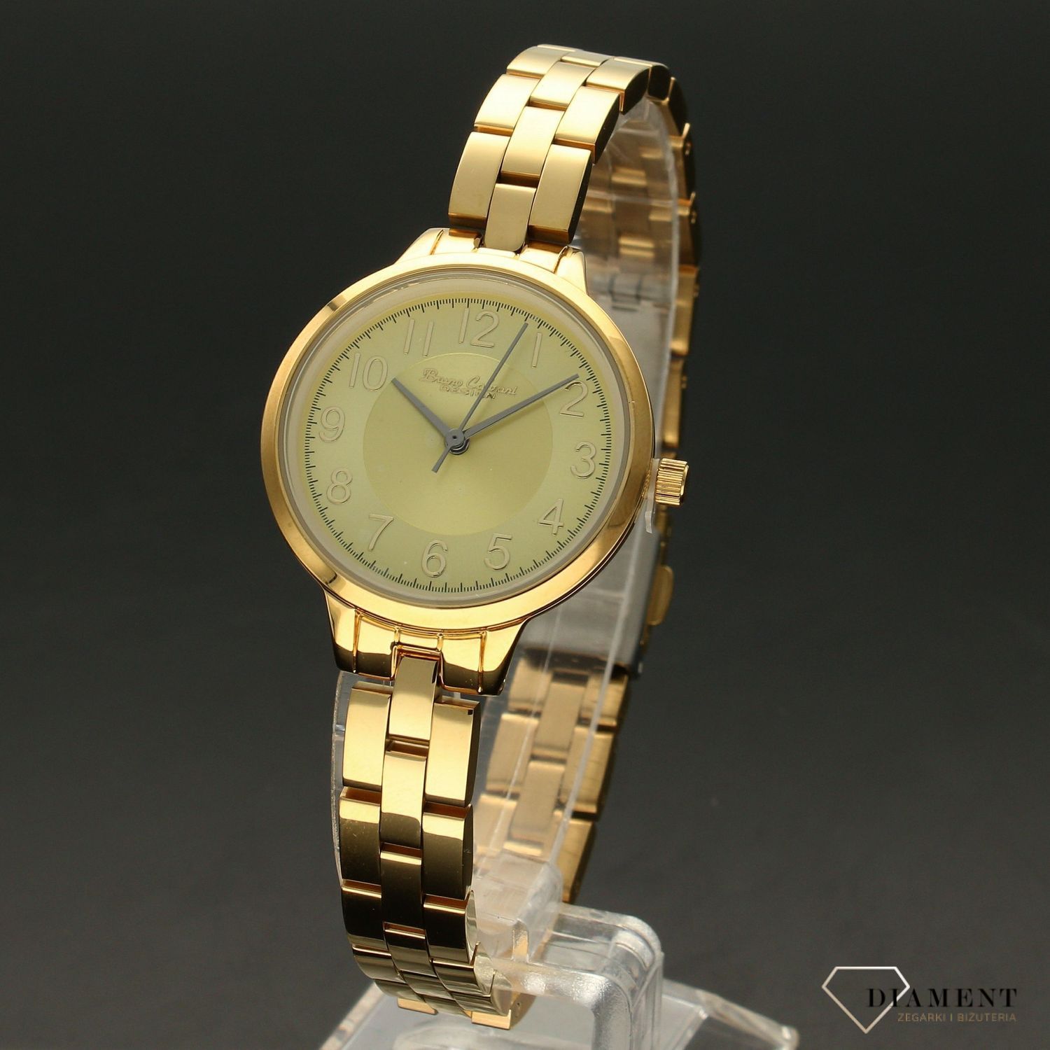 Zegarek damski BRUNO CALVANI złoty BC9596 DOUBLE GOLD. Zegarek damski w złotej kolorystyce z wyraźną tarczą. Zegarek damski wyposażony w mechanizm kwarcowy zasilany na baterię. Zegarek damski  (2).jpg